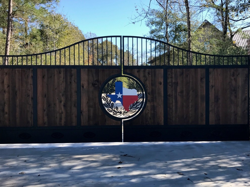 Mountain style pivot front door photo in Houston