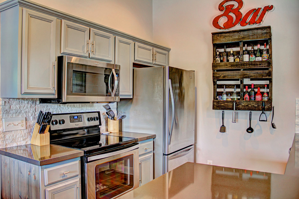 Eat-in kitchen - small rustic galley vinyl floor eat-in kitchen idea with an undermount sink, glass-front cabinets, gray cabinets, quartz countertops, white backsplash, stone tile backsplash, stainless steel appliances and a peninsula