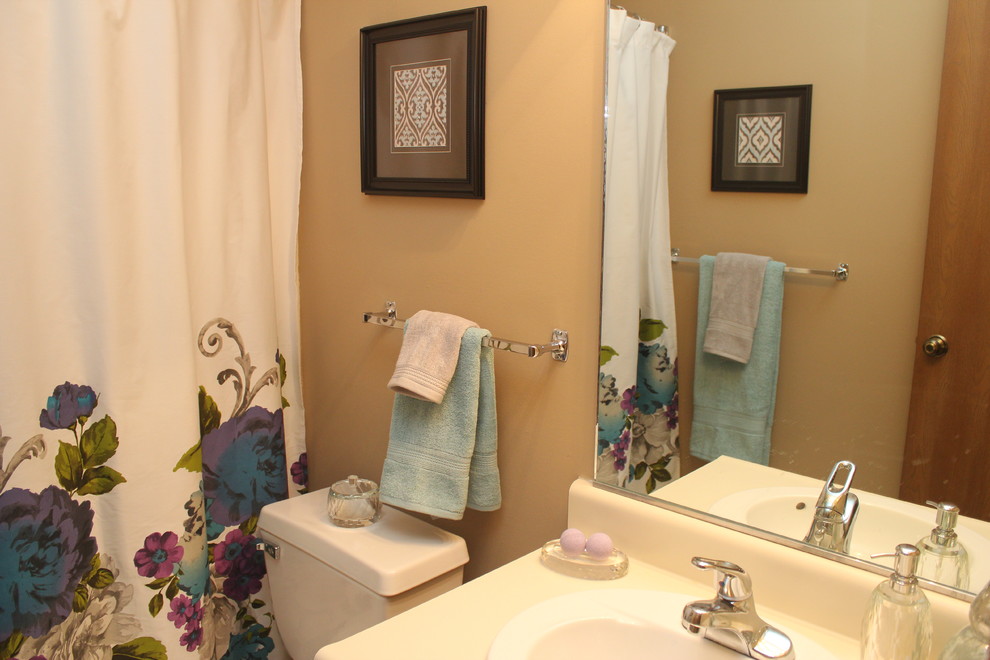 Inspiration for a small transitional master vinyl floor tub/shower combo remodel with a two-piece toilet and beige walls