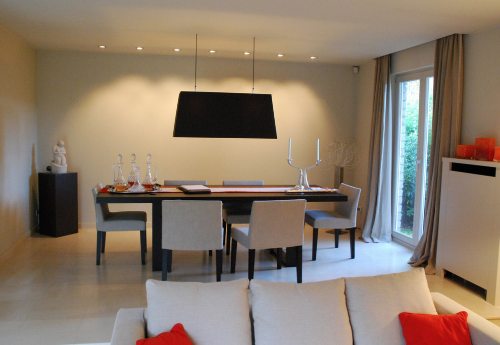 Large contemporary dining room in Brussels with white walls, ceramic floors and white floor.
