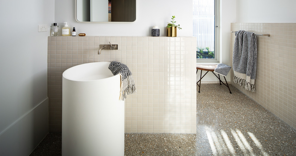 Design ideas for a mid-sized contemporary master bathroom in Melbourne with glass-front cabinets, white cabinets, an alcove shower, a one-piece toilet, multi-coloured tile, marble, white walls, concrete floors, a pedestal sink, solid surface benchtops, grey floor, an open shower and grey benchtops.