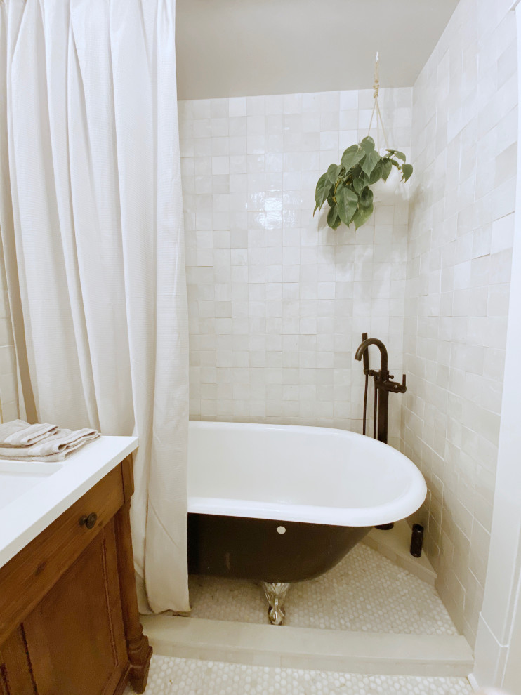 Design ideas for a small arts and crafts master bathroom in Seattle with recessed-panel cabinets, brown cabinets, a claw-foot tub, a shower/bathtub combo, a two-piece toilet, white tile, terra-cotta tile, white walls, mosaic tile floors, an undermount sink, engineered quartz benchtops, white floor, a shower curtain, white benchtops, a single vanity, a freestanding vanity and decorative wall panelling.