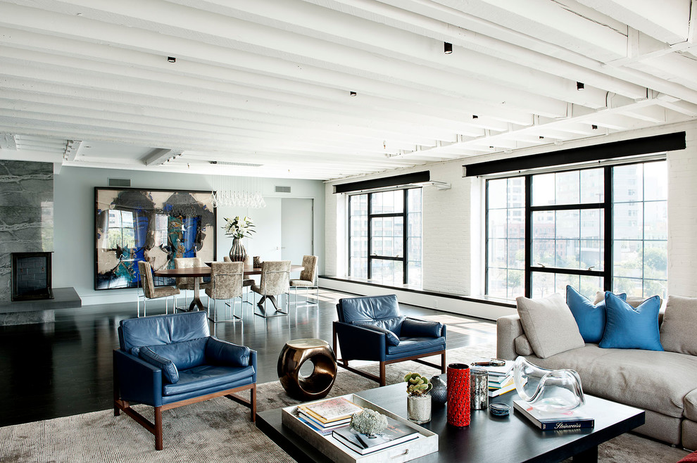 Photo of a large industrial open concept living room in New York.