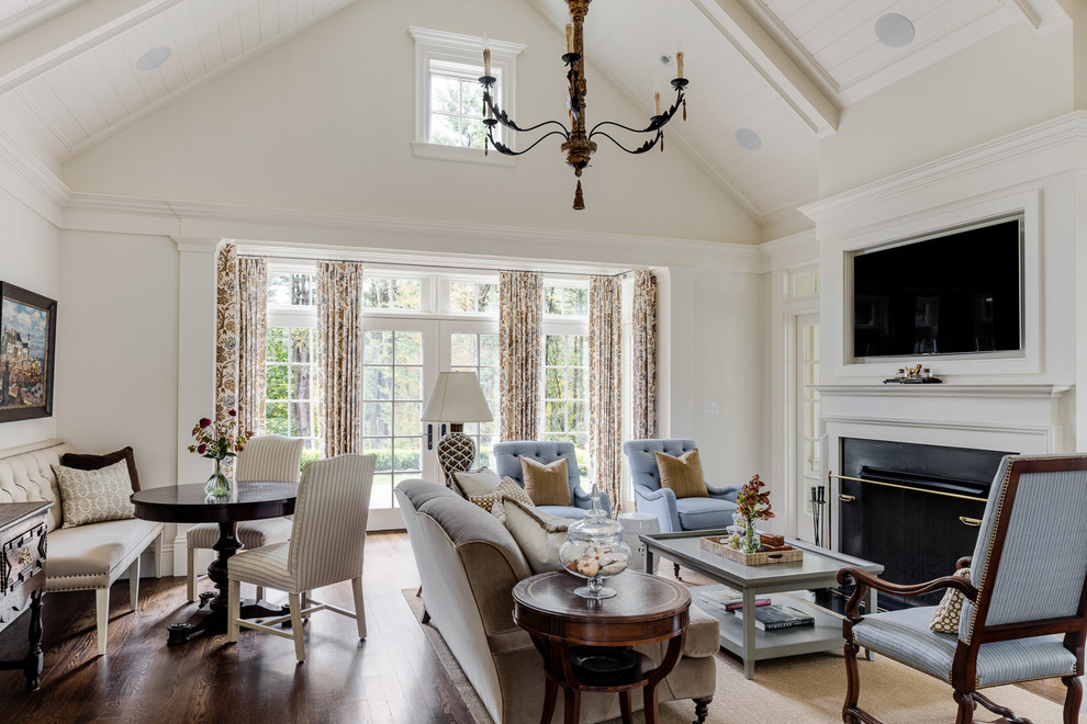 Mid-sized country family room in Boston with white walls, a standard fireplace, brown floor, dark hardwood floors and a built-in media wall.