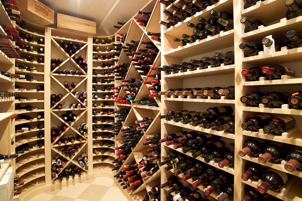 Photo of a traditional wine cellar in Boston with storage racks.