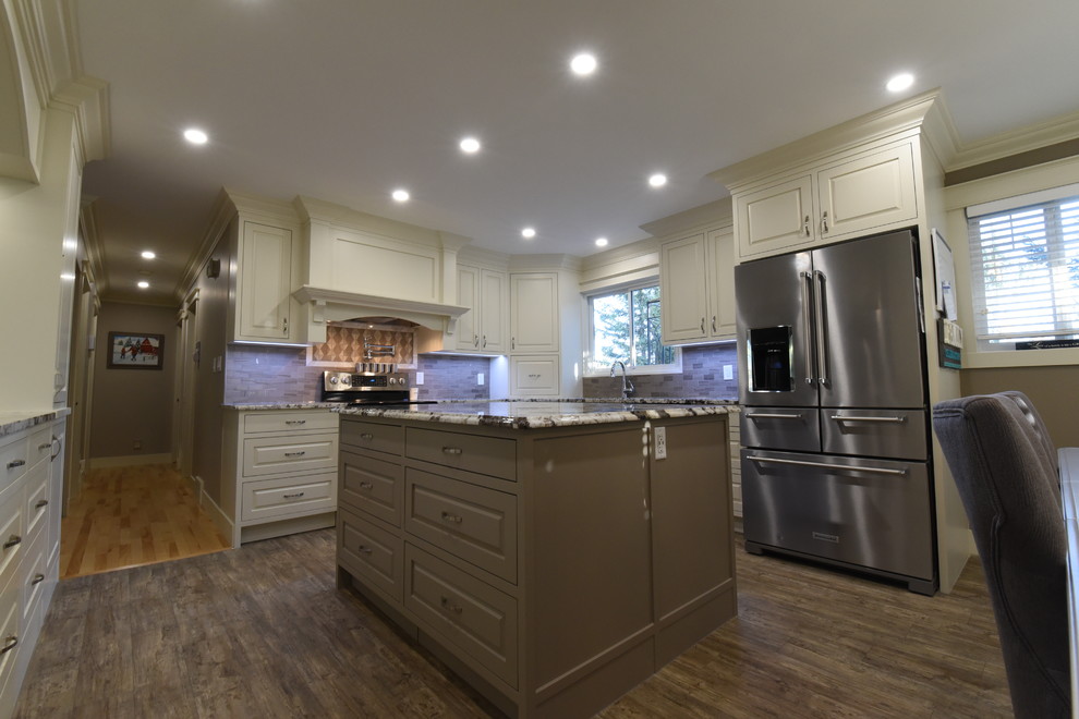 Example of a mid-sized transitional u-shaped vinyl floor and gray floor eat-in kitchen design in Calgary with an undermount sink, beaded inset cabinets, white cabinets, granite countertops, gray backsplash, ceramic backsplash, stainless steel appliances, two islands and gray countertops