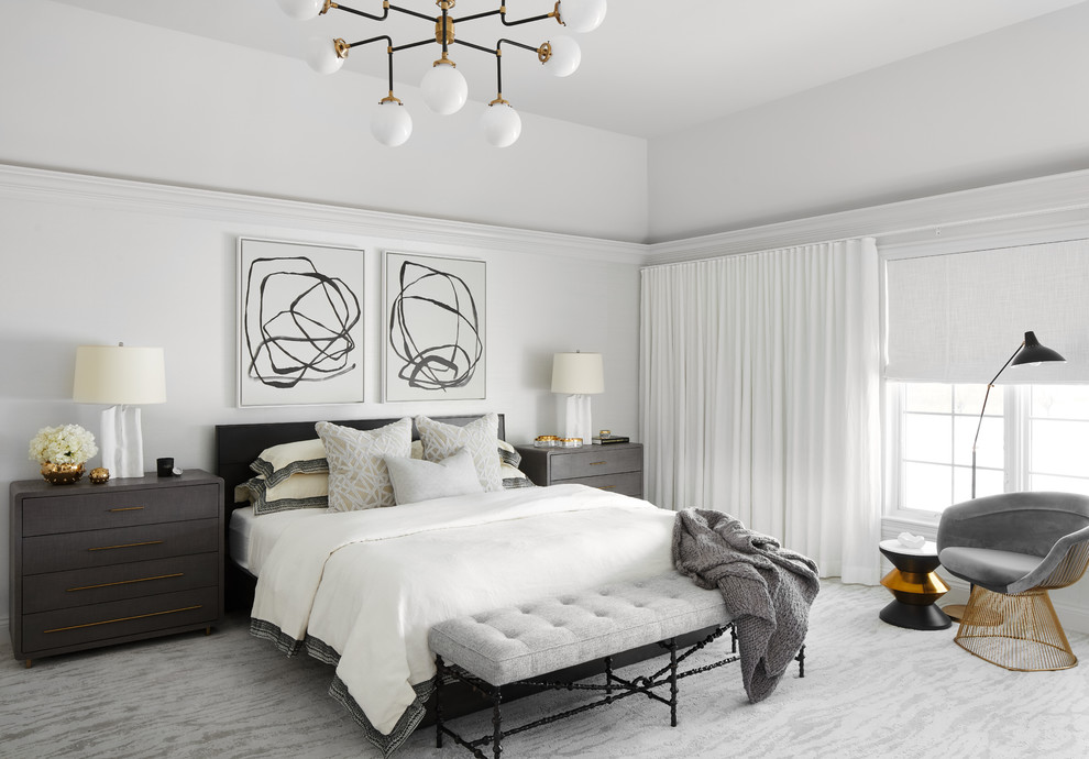 This is an example of an expansive contemporary master bedroom in Chicago with white walls, carpet and grey floor.