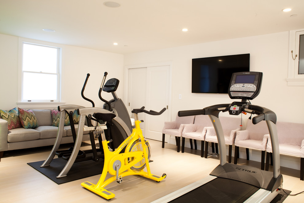 Photo of a contemporary multipurpose gym in Other with white walls and beige floor.
