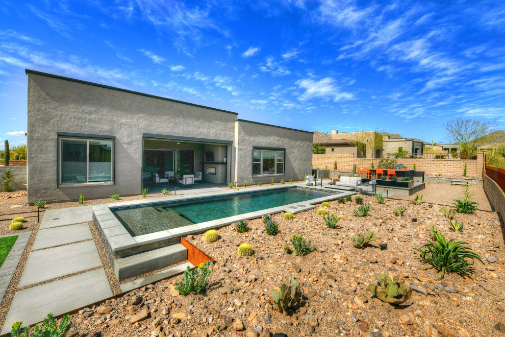 Mid-sized minimalist pool photo in Phoenix