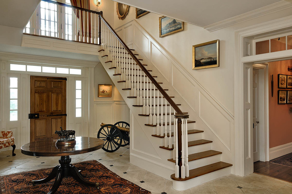 Inspiration for a country foyer in New York with beige walls.