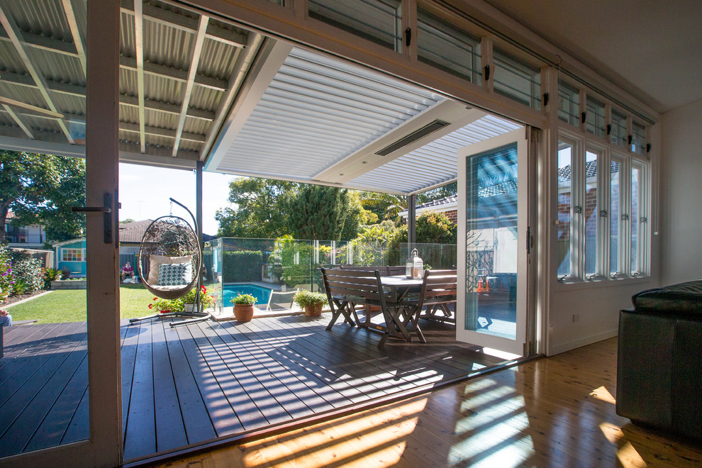 Inspiration for a mid-sized beach style courtyard patio in Sydney with a pergola.