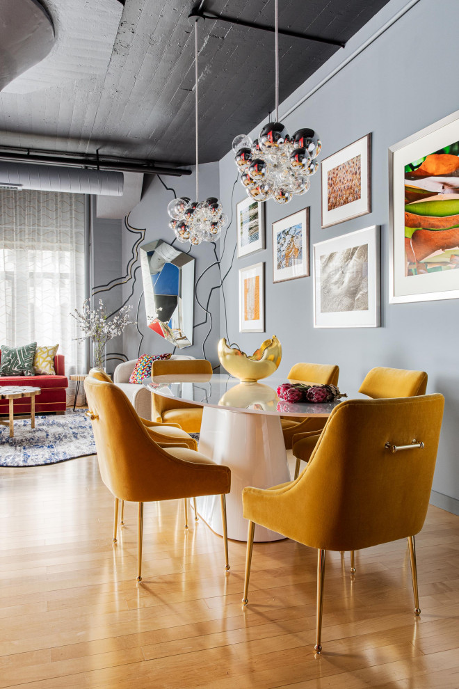 Inspiration for a mid-sized eclectic open plan dining in Boston with grey walls, medium hardwood floors, no fireplace and beige floor.