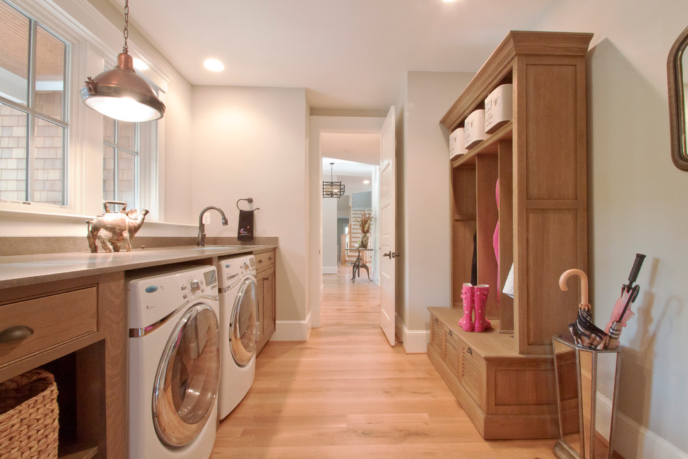 This is an example of a traditional laundry room in DC Metro with beige walls and beige benchtop.