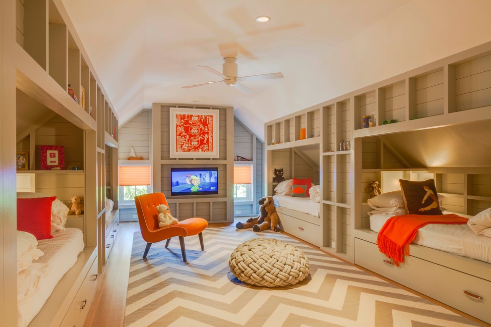 Design ideas for a large contemporary gender-neutral kids' playroom for kids 4-10 years old in Boston with light hardwood floors.