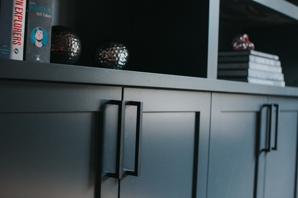 Example of a transitional home design design in Calgary