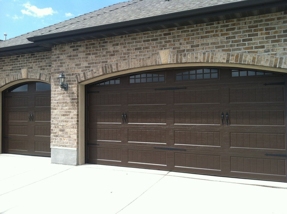 Photo of a mid-sized traditional attached three-car carport in Salt Lake City.