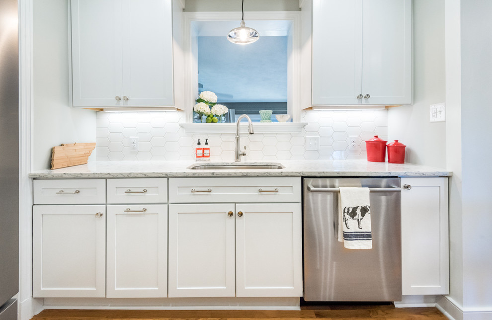 Kitchen - transitional medium tone wood floor kitchen idea in Richmond with a single-bowl sink, shaker cabinets, white cabinets, quartzite countertops, stainless steel appliances, a peninsula, white backsplash and mosaic tile backsplash