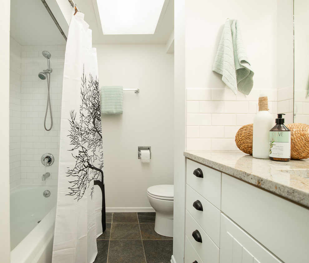 Photo of a small country master bathroom in Seattle with white cabinets, white tile, subway tile, white walls, slate floors, an undermount sink, granite benchtops, multi-coloured floor and multi-coloured benchtops.