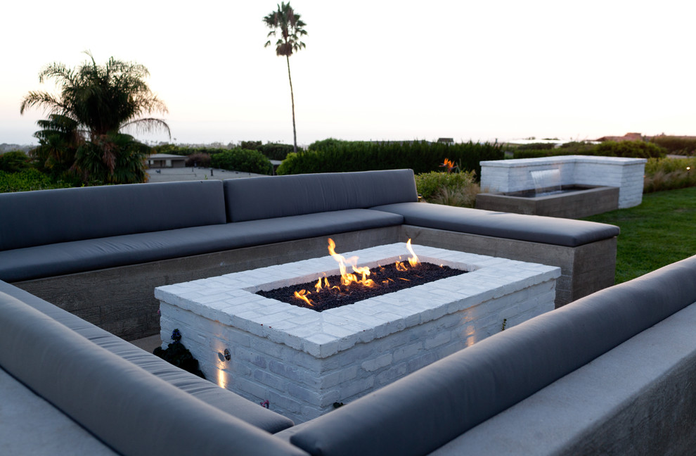 Inspiration for a contemporary patio in Orange County with a fire feature.