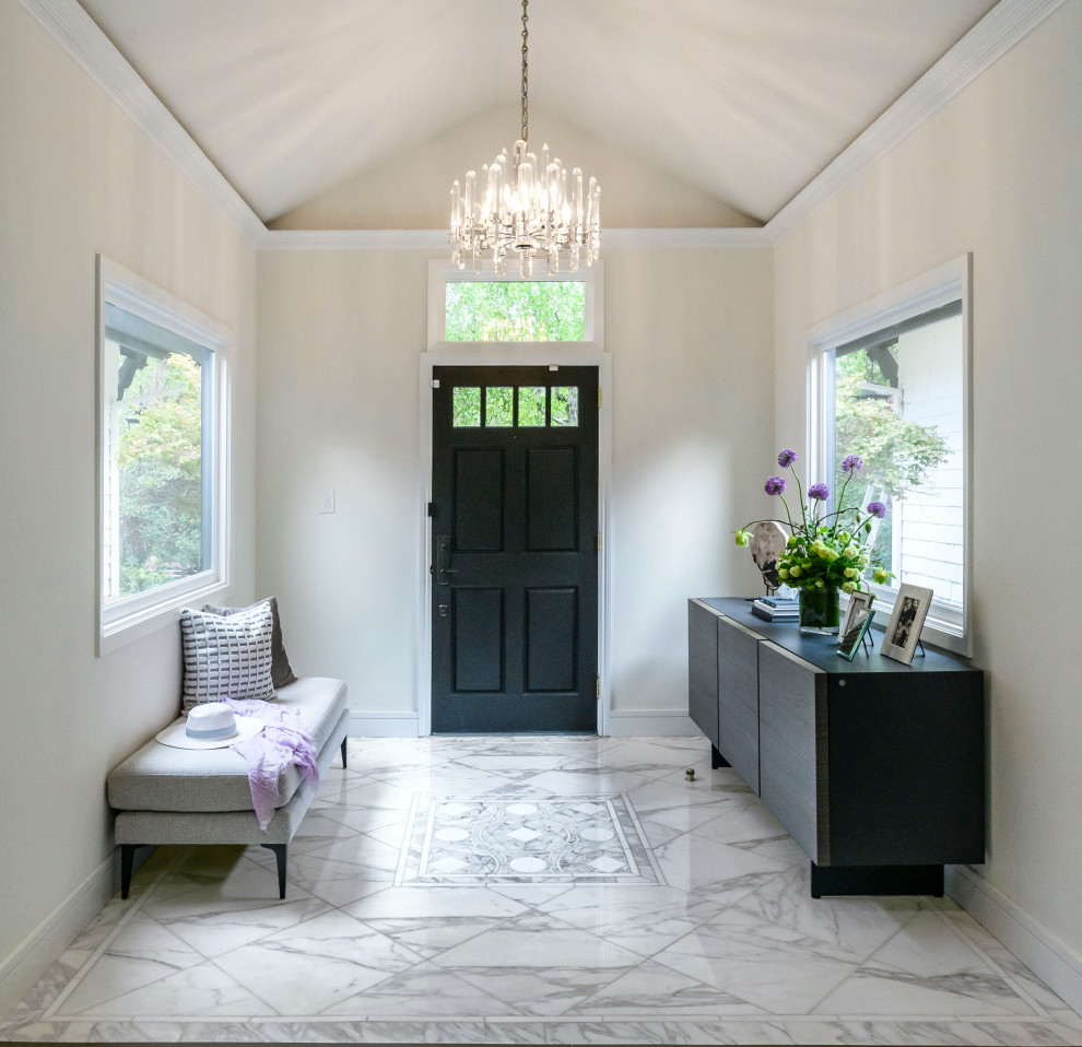Inspiration for a transitional vestibule in San Francisco with white walls, marble floors, a single front door, a black front door, multi-coloured floor and vaulted.