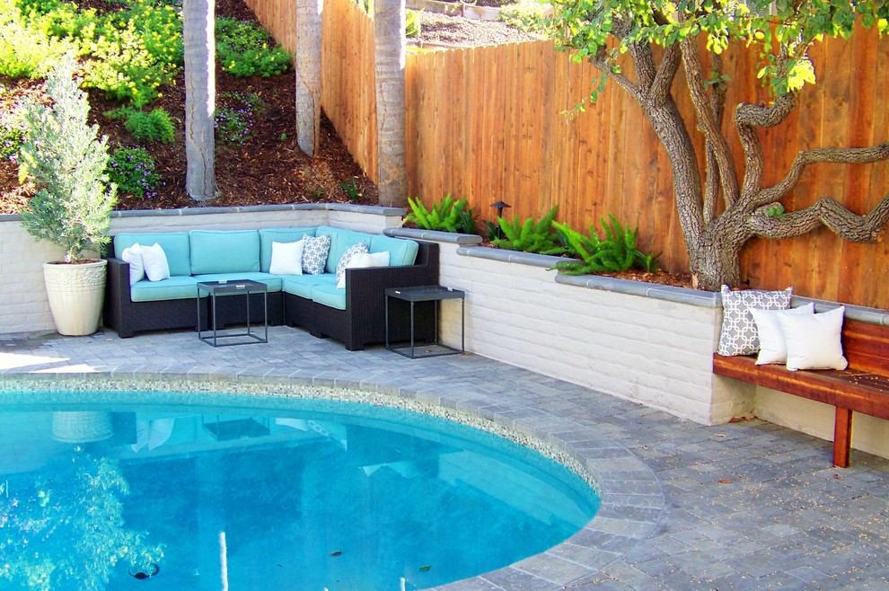 Inspiration for a contemporary patio in San Diego with brick pavers.