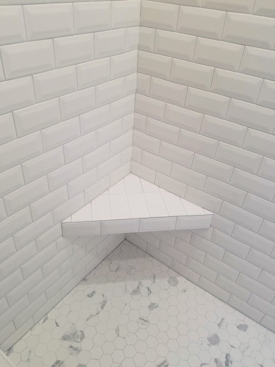 Photo of a mid-sized modern master bathroom in Chicago with shaker cabinets, dark wood cabinets, an alcove shower, a two-piece toilet, white tile, porcelain tile, grey walls, porcelain floors, an undermount sink, quartzite benchtops, multi-coloured floor, an open shower and white benchtops.