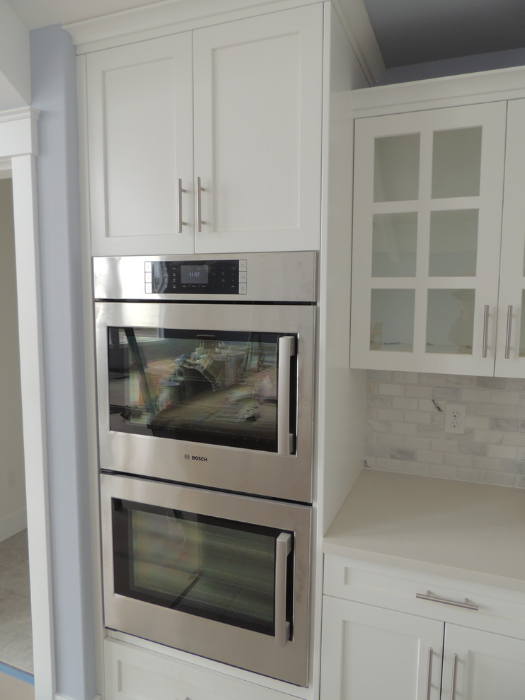 Example of a transitional kitchen design in Seattle