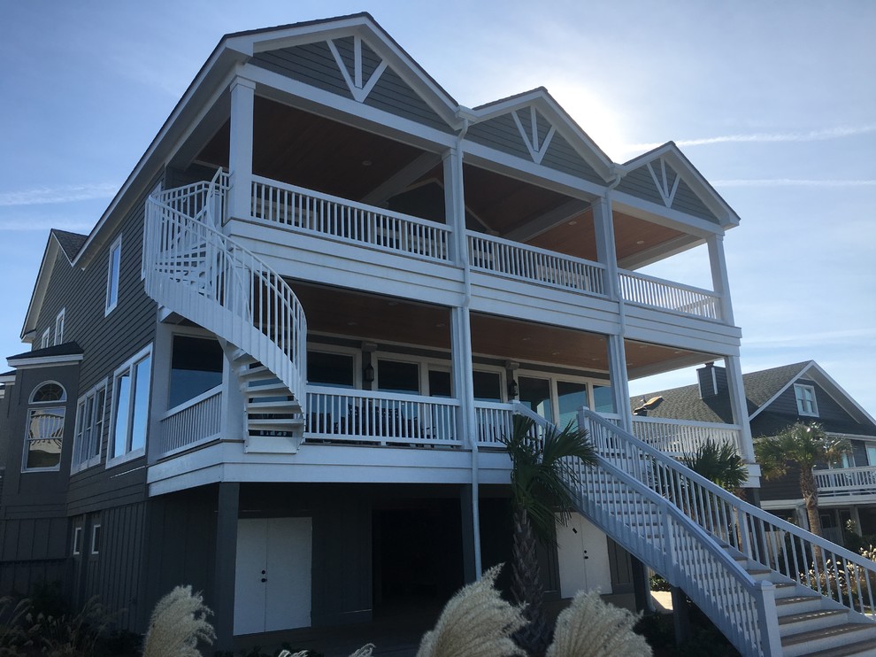 Inspiration for a large transitional two-story wood gray home design remodel
