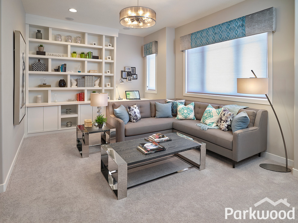 This is an example of a traditional open concept family room in Edmonton with grey walls, carpet and a wall-mounted tv.