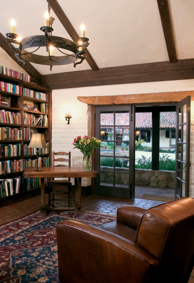 Country family room in Santa Barbara with a library.