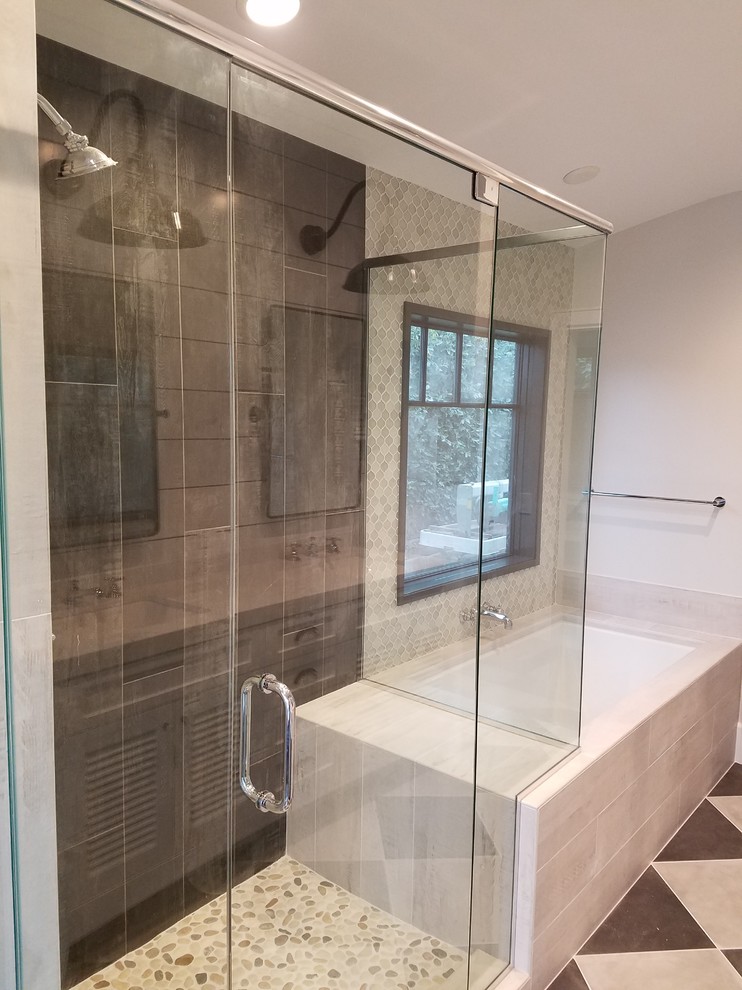 Photo of a mid-sized contemporary master bathroom in Orange County with an undermount tub, a corner shower, gray tile, slate, beige walls, ceramic floors, multi-coloured floor, a hinged shower door and brown benchtops.