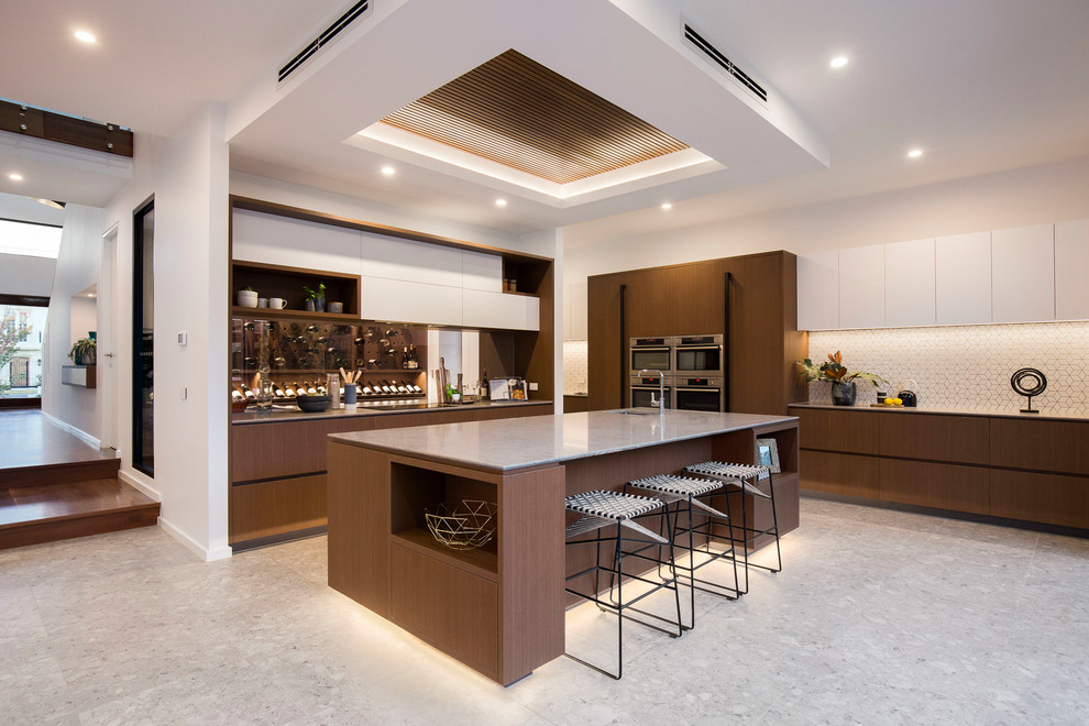 Design ideas for a contemporary kitchen in Melbourne with a single-bowl sink, flat-panel cabinets, dark wood cabinets, white splashback, stainless steel appliances, with island, grey floor and grey benchtop.