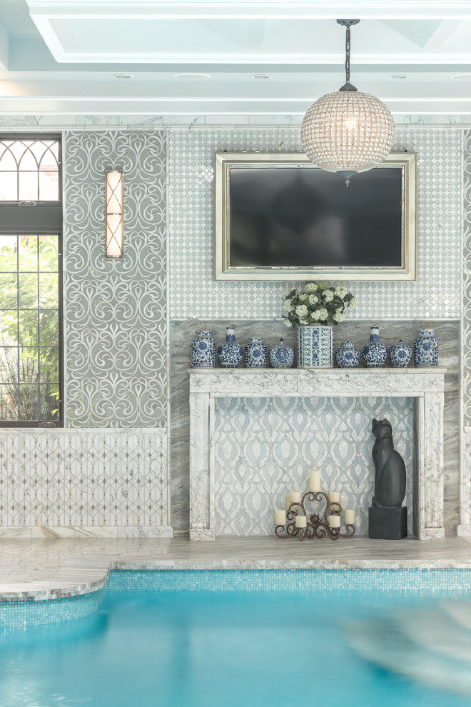 Inspiration for a traditional indoor pool in New York with tile.