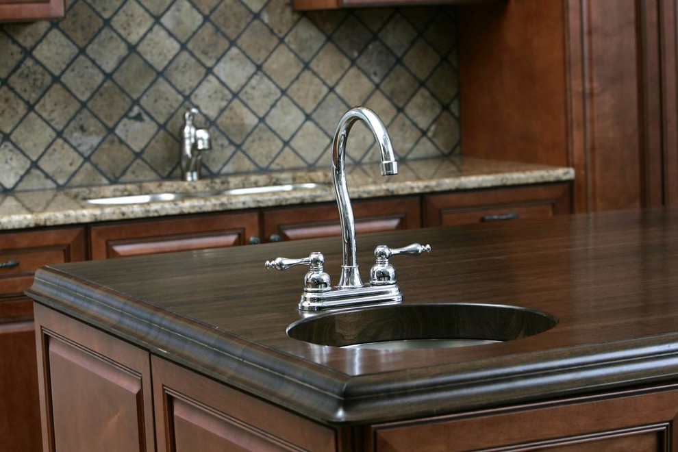 Kitchen - kitchen idea with white cabinets and granite countertops