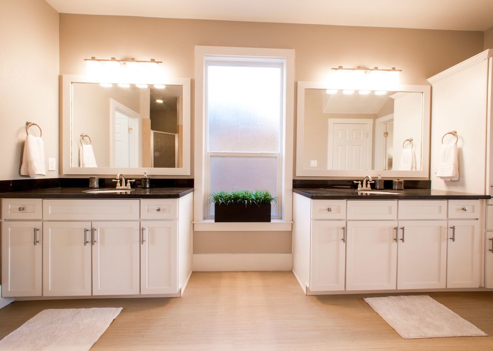 Example of a transitional master beige tile and porcelain tile porcelain tile home design design in Austin with shaker cabinets, white cabinets, beige walls, an undermount sink and granite countertops