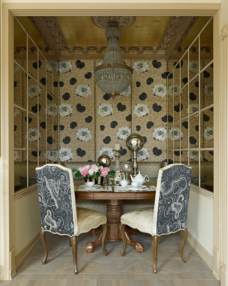 This is an example of a small traditional separate dining room in Moscow with metallic walls and light hardwood floors.