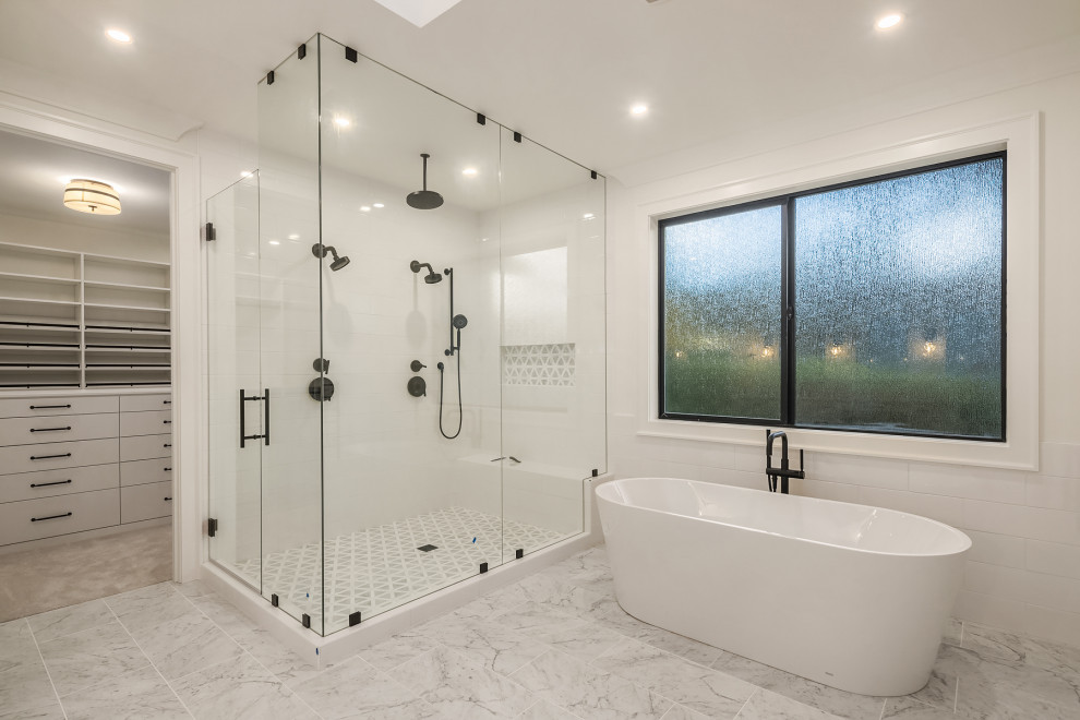 Bathroom - large country master white tile and ceramic tile marble floor, gray floor, double-sink and shiplap wall bathroom idea in Seattle with shaker cabinets, white cabinets, a one-piece toilet, white walls, an undermount sink, marble countertops, gray countertops, a niche and a built-in vanity