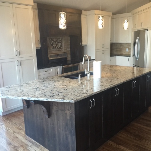Eat-in kitchen - transitional medium tone wood floor eat-in kitchen idea in Calgary with shaker cabinets, black cabinets, granite countertops and an island