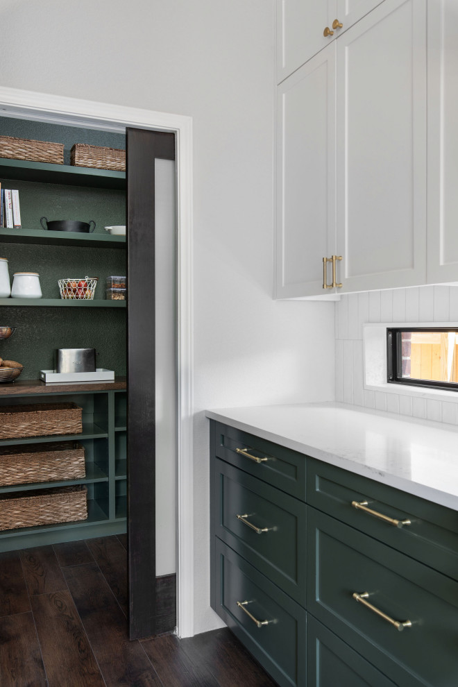 Large transitional u-shaped dark wood floor and brown floor open concept kitchen photo in Austin with an undermount sink, shaker cabinets, green cabinets, quartz countertops, white backsplash, porcelain backsplash, stainless steel appliances, a peninsula and white countertops