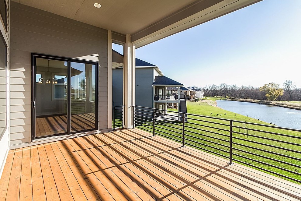 Deck - large transitional backyard deck idea with a roof extension
