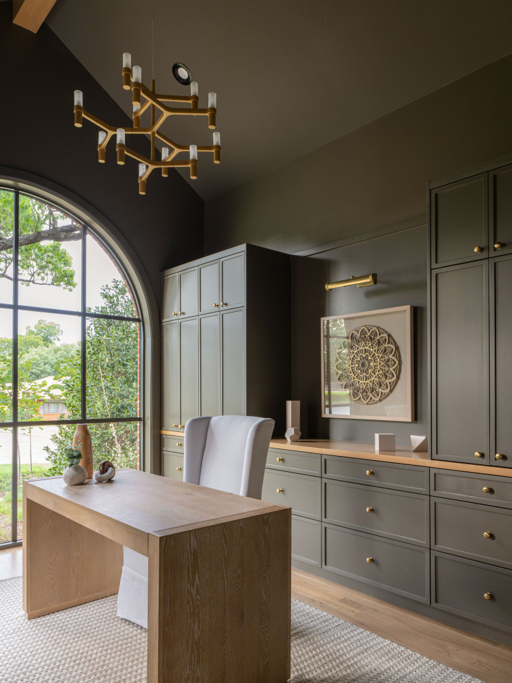 Home office - transitional freestanding desk medium tone wood floor, brown floor, exposed beam and vaulted ceiling home office idea in Dallas with green walls