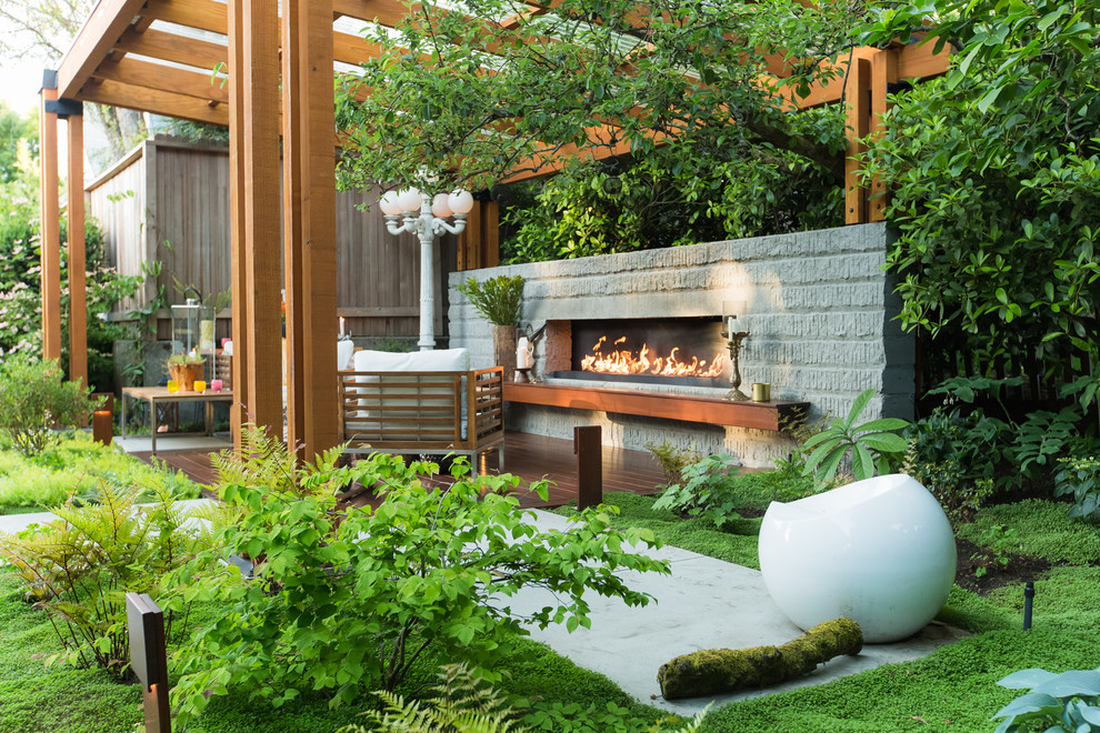 Design ideas for a mid-sized contemporary backyard deck in Seattle with with fireplace.