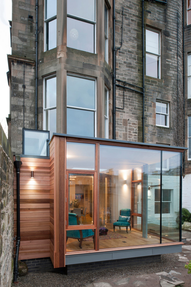 Mid-sized contemporary three-storey brick duplex exterior in Edinburgh.