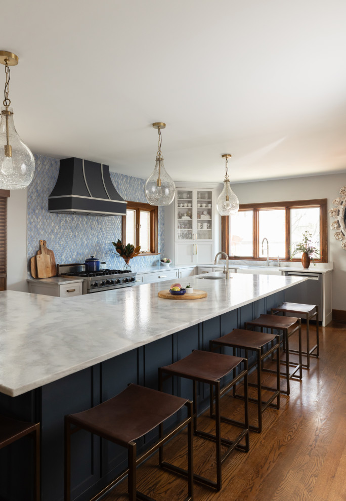 Example of a large transitional l-shaped open concept kitchen design in Chicago with an island