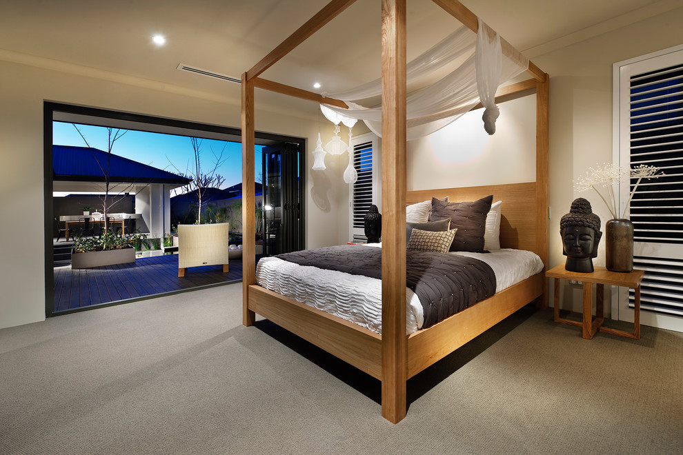 This is an example of a mid-sized contemporary bedroom in Perth with beige walls, carpet and no fireplace.