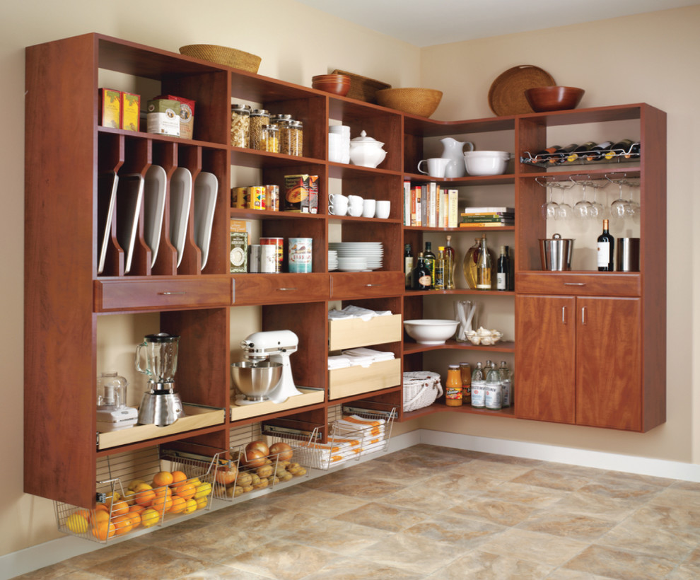 Inspiration for a large traditional l-shaped kitchen pantry in New York with flat-panel cabinets, medium wood cabinets, terra-cotta floors and no island.