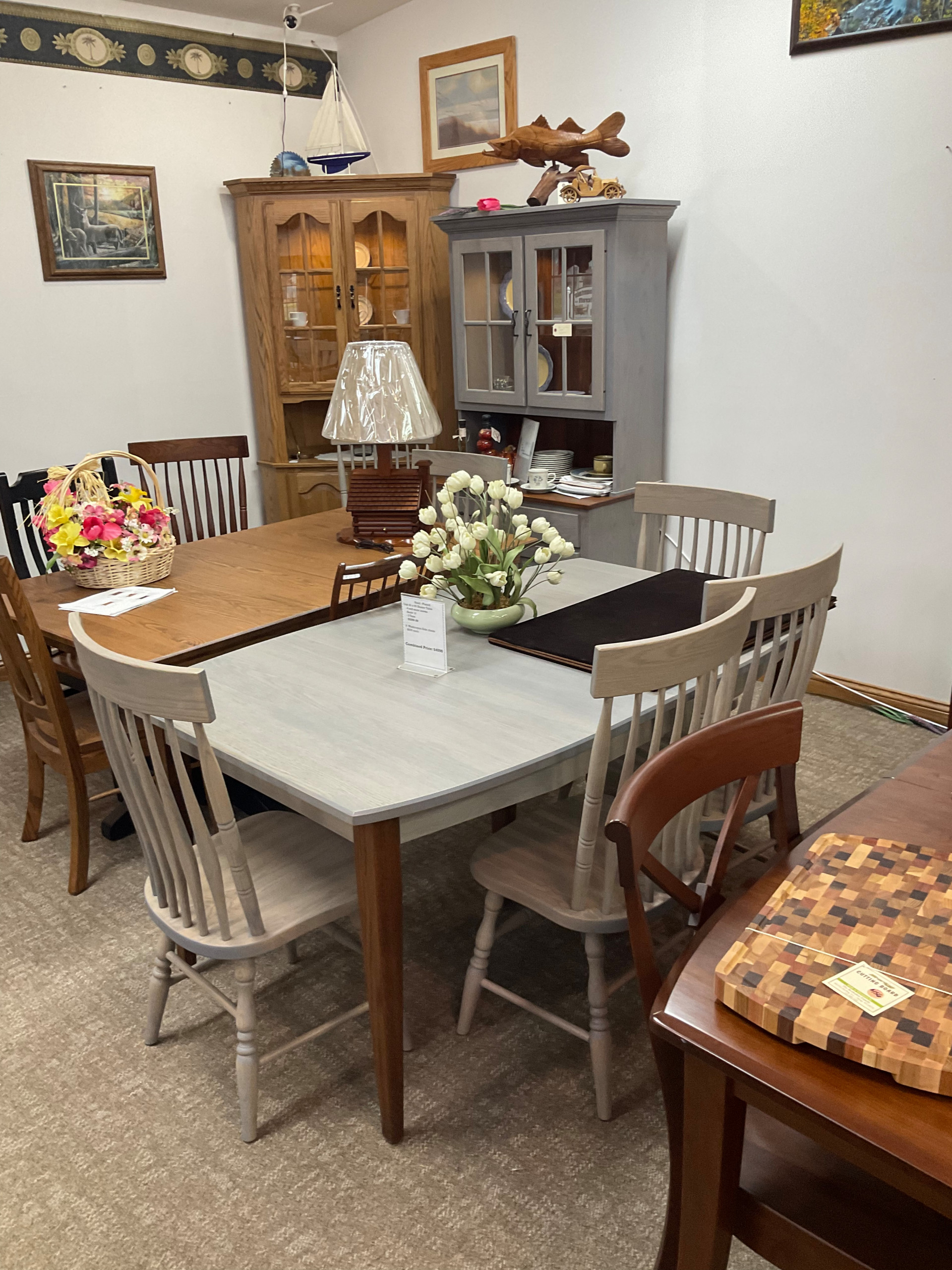 42 x 66 boat shaped gray stone table. Washington square back chairs. Gray stone