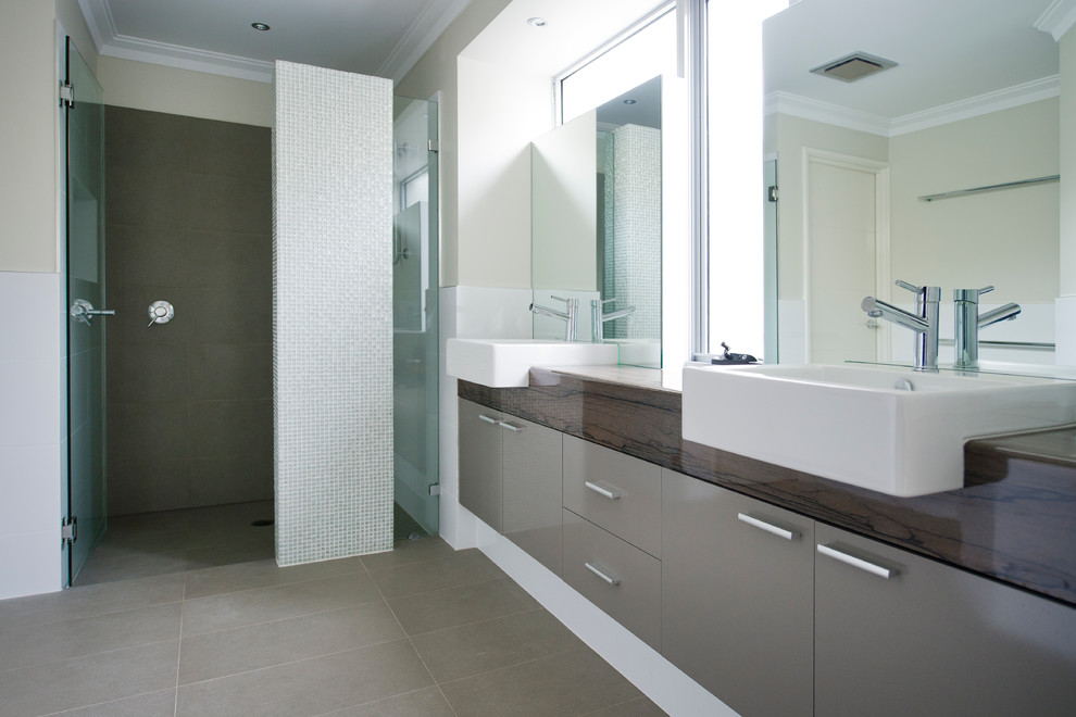 Contemporary wet room bathroom in Perth with flat-panel cabinets, beige cabinets, a trough sink, brown floor and a hinged shower door.