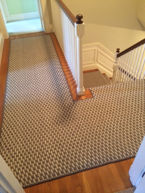 Example of a large transitional carpeted l-shaped staircase design in Boston with carpeted risers