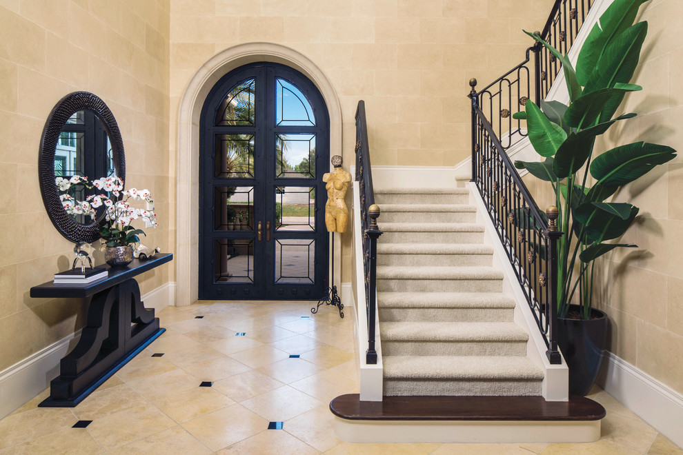 Design ideas for a mediterranean foyer in Miami with beige walls, a double front door and a black front door.